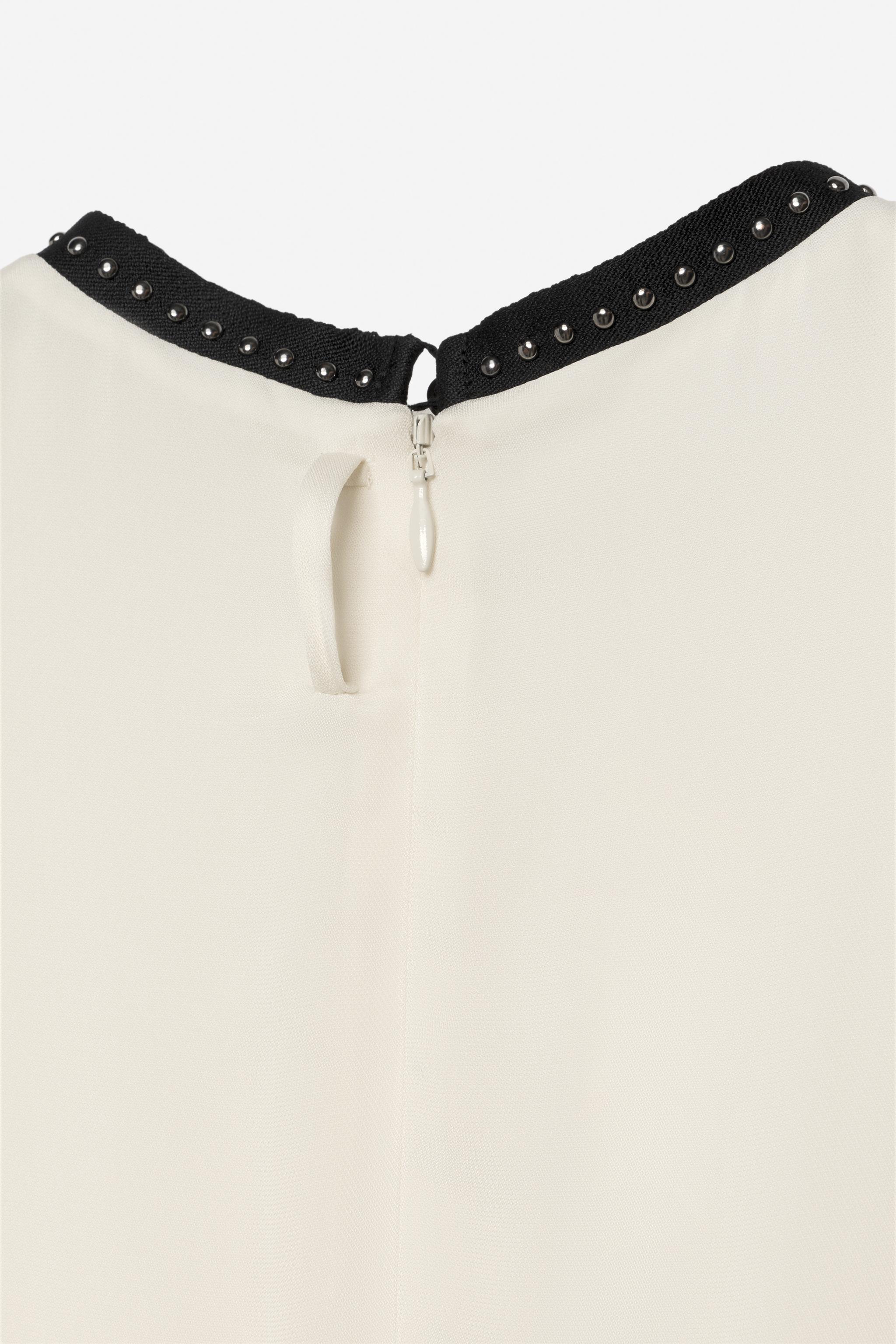 ROBE BRIDES ET CLOUS EN CONTRASTE - THE ITEM
